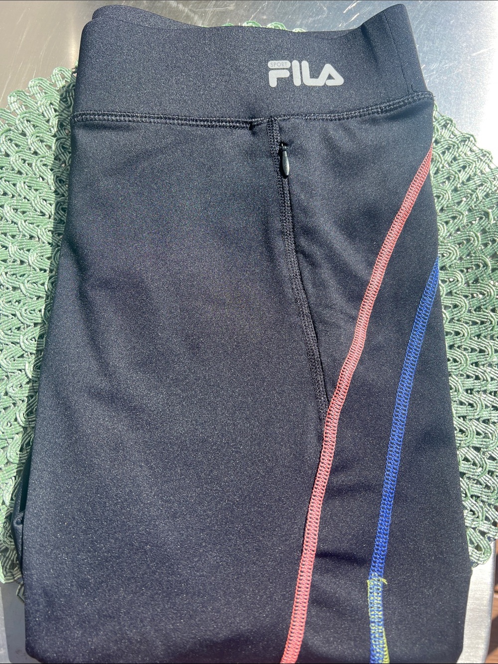 NWOT woman’s FILA Black cropped Leggings with Pink and Blue Contrast Seams. Med.